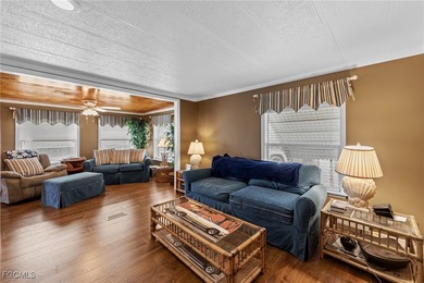 You'll love this unique manufactured home with RARE, attached on Six Lakes Country Club in Florida - for sale on GolfHomes.com, golf home, golf lot