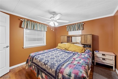 You'll love this unique manufactured home with RARE, attached on Six Lakes Country Club in Florida - for sale on GolfHomes.com, golf home, golf lot