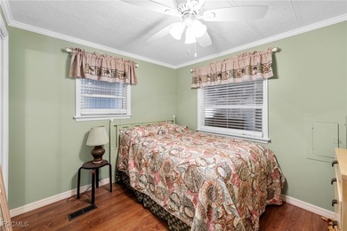 You'll love this unique manufactured home with RARE, attached on Six Lakes Country Club in Florida - for sale on GolfHomes.com, golf home, golf lot