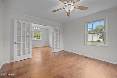 Charming 4-bedroom, 3-bath home located in the heart of on Jacksonville Country Club in North Carolina - for sale on GolfHomes.com, golf home, golf lot