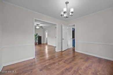 Charming 4-bedroom, 3-bath home located in the heart of on Jacksonville Country Club in North Carolina - for sale on GolfHomes.com, golf home, golf lot