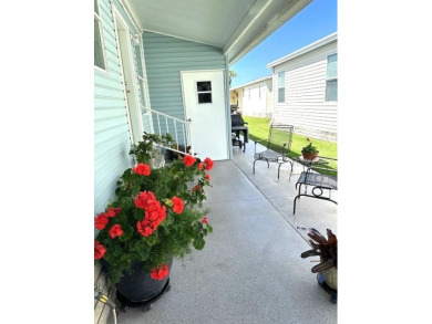 MOVE RIGHT INTO THIS METICULOUSLY CLEAN 2 bedroom 2 bath home on Lily Lake Golf and RV Resort in Florida - for sale on GolfHomes.com, golf home, golf lot