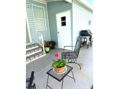 MOVE RIGHT INTO THIS METICULOUSLY CLEAN 2 bedroom 2 bath home on Lily Lake Golf and RV Resort in Florida - for sale on GolfHomes.com, golf home, golf lot