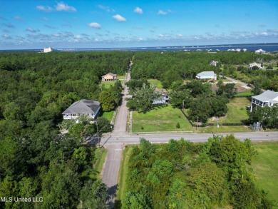 This fantastic lot features numerous adolescent oak trees on The Bridges Golf Club At Hollywood Casino in Mississippi - for sale on GolfHomes.com, golf home, golf lot