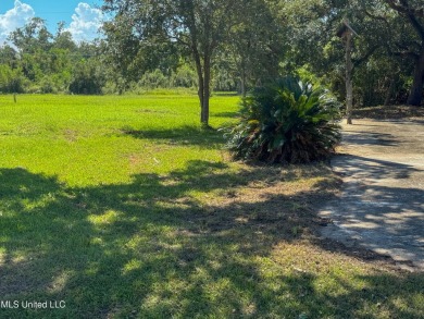 This fantastic lot features numerous adolescent oak trees on The Bridges Golf Club At Hollywood Casino in Mississippi - for sale on GolfHomes.com, golf home, golf lot