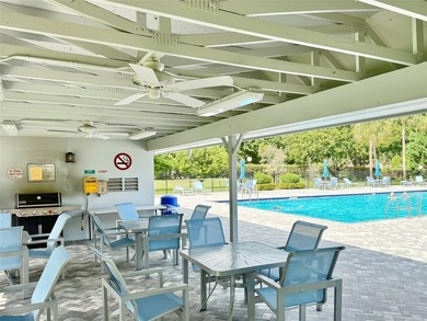 ACTIVE 55+ community! Bright 2nd floor home w/pool view. Receive on Wynmoor Golf Course in Florida - for sale on GolfHomes.com, golf home, golf lot