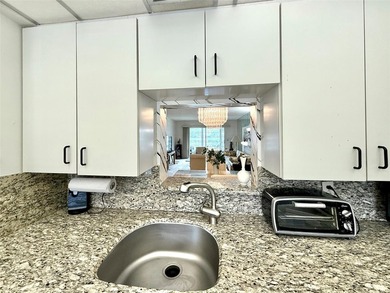 ACTIVE 55+ community! Bright 2nd floor home w/pool view. Receive on Wynmoor Golf Course in Florida - for sale on GolfHomes.com, golf home, golf lot