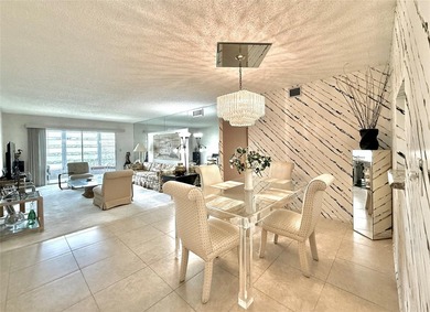 ACTIVE 55+ community! Bright 2nd floor home w/pool view. Receive on Wynmoor Golf Course in Florida - for sale on GolfHomes.com, golf home, golf lot