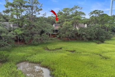 Overlooking the ever-changing tidal marsh, this charming on The Seabrook Island Club in South Carolina - for sale on GolfHomes.com, golf home, golf lot