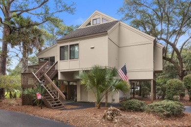 Overlooking the ever-changing tidal marsh, this charming on The Seabrook Island Club in South Carolina - for sale on GolfHomes.com, golf home, golf lot