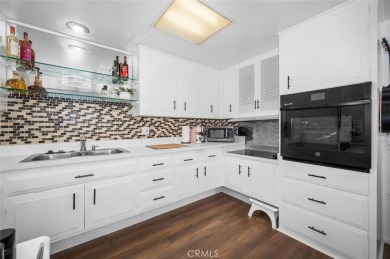Charming 1-bedroom with unique vibe in prime drive-up location on Leisure World Seal Beach Golf Course in California - for sale on GolfHomes.com, golf home, golf lot