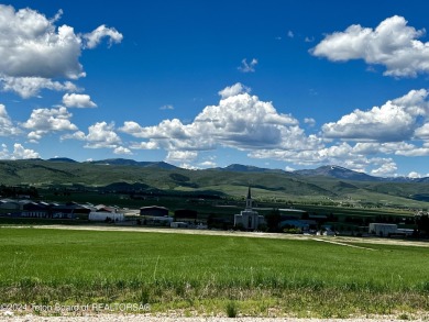 This elevated, rural lot has a panoramic view of the mountains on Valli Vu Golf Course in Wyoming - for sale on GolfHomes.com, golf home, golf lot