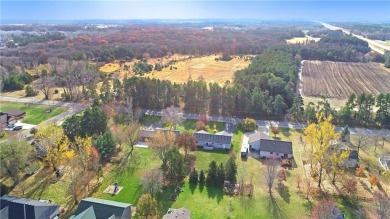 Nestled just a stones throw away from the beauty and serenity of on Oak Hill Golf Club in Minnesota - for sale on GolfHomes.com, golf home, golf lot