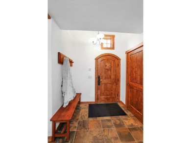 Tucked beneath mature trees for just the right amount of privacy on Osprey Meadows at Tamarack Resort in Idaho - for sale on GolfHomes.com, golf home, golf lot
