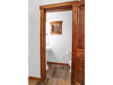 Tucked beneath mature trees for just the right amount of privacy on Osprey Meadows at Tamarack Resort in Idaho - for sale on GolfHomes.com, golf home, golf lot