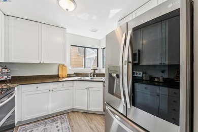 Discover this stunning, upgraded 2-bedroom, 2-bath top-floor end on The Bridges Golf Club in California - for sale on GolfHomes.com, golf home, golf lot