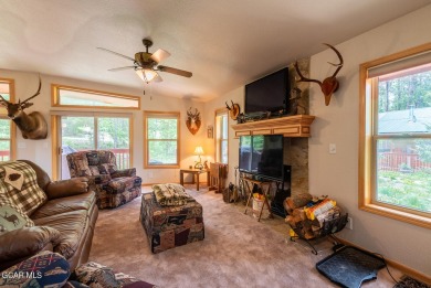 This turnkey furnished 3bd/2bath Ranch sits on a full third acre on Grand Lake Golf Course in Colorado - for sale on GolfHomes.com, golf home, golf lot