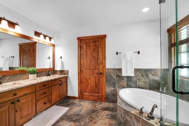 Tucked beneath mature trees for just the right amount of privacy on Osprey Meadows at Tamarack Resort in Idaho - for sale on GolfHomes.com, golf home, golf lot