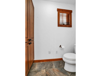Tucked beneath mature trees for just the right amount of privacy on Osprey Meadows at Tamarack Resort in Idaho - for sale on GolfHomes.com, golf home, golf lot