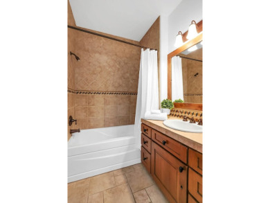 Tucked beneath mature trees for just the right amount of privacy on Osprey Meadows at Tamarack Resort in Idaho - for sale on GolfHomes.com, golf home, golf lot