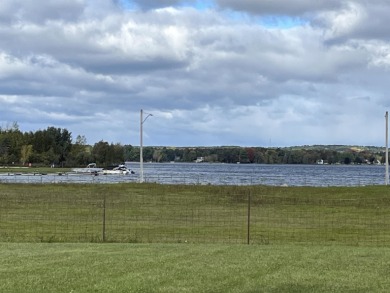 Beautiful level lot with awesome view of Lake Lancer.  Front row on Lakeside Golf Course in Michigan - for sale on GolfHomes.com, golf home, golf lot