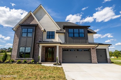 This beautifully appointed 4-bedroom, 3-bath residence offers 3 on Tennessee National Golf Club in Tennessee - for sale on GolfHomes.com, golf home, golf lot