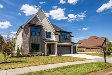 This beautifully appointed 4-bedroom, 3-bath residence offers 3 on Tennessee National Golf Club in Tennessee - for sale on GolfHomes.com, golf home, golf lot