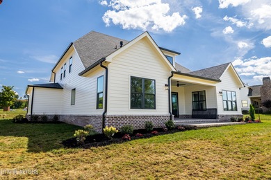 This beautifully appointed 4-bedroom, 3-bath residence offers 3 on Tennessee National Golf Club in Tennessee - for sale on GolfHomes.com, golf home, golf lot