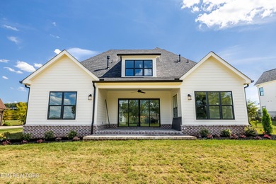 This beautifully appointed 4-bedroom, 3-bath residence offers 3 on Tennessee National Golf Club in Tennessee - for sale on GolfHomes.com, golf home, golf lot