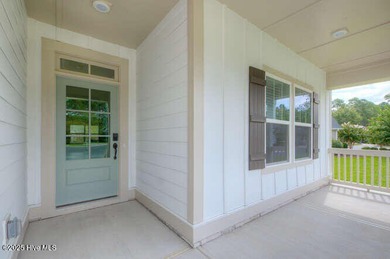 Welcome to this beautifully appointed 4-bedroom, 3-bath home on Carolina National Golf Club in North Carolina - for sale on GolfHomes.com, golf home, golf lot