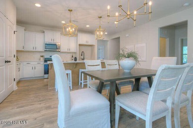 Welcome to this beautifully appointed 4-bedroom, 3-bath home on Carolina National Golf Club in North Carolina - for sale on GolfHomes.com, golf home, golf lot