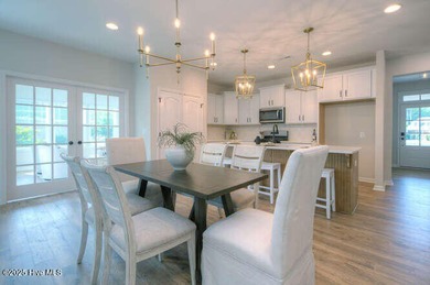 Welcome to this beautifully appointed 4-bedroom, 3-bath home on Carolina National Golf Club in North Carolina - for sale on GolfHomes.com, golf home, golf lot