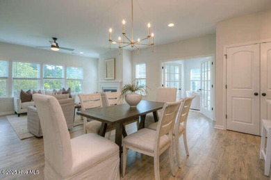 Welcome to this beautifully appointed 4-bedroom, 3-bath home on Carolina National Golf Club in North Carolina - for sale on GolfHomes.com, golf home, golf lot