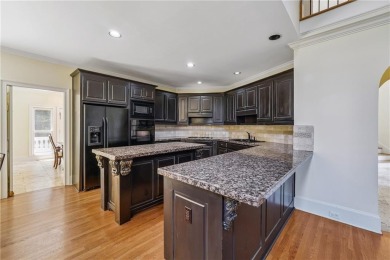 Experience three fully finished levels of exceptional living on The Golf Club of Georgia in Georgia - for sale on GolfHomes.com, golf home, golf lot