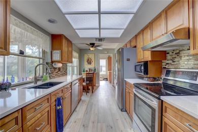 Welcome to elevated Florida living at its finest in this on Highland Lakes Executive Golf Course in Florida - for sale on GolfHomes.com, golf home, golf lot