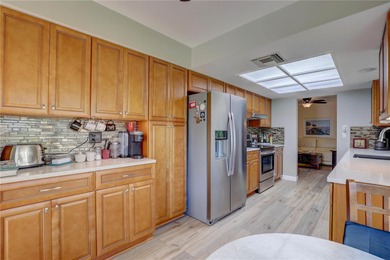 Welcome to elevated Florida living at its finest in this on Highland Lakes Executive Golf Course in Florida - for sale on GolfHomes.com, golf home, golf lot