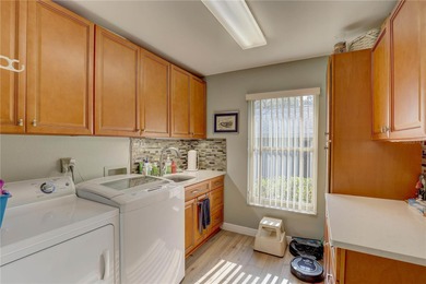 Welcome to elevated Florida living at its finest in this on Highland Lakes Executive Golf Course in Florida - for sale on GolfHomes.com, golf home, golf lot