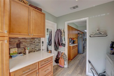 Welcome to elevated Florida living at its finest in this on Highland Lakes Executive Golf Course in Florida - for sale on GolfHomes.com, golf home, golf lot