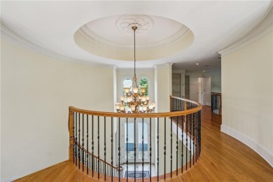 Experience three fully finished levels of exceptional living on The Golf Club of Georgia in Georgia - for sale on GolfHomes.com, golf home, golf lot