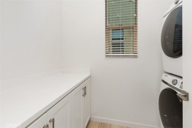 This modern turnkey home features three bedrooms, two and a half on Glen Ivy Golf Club in California - for sale on GolfHomes.com, golf home, golf lot