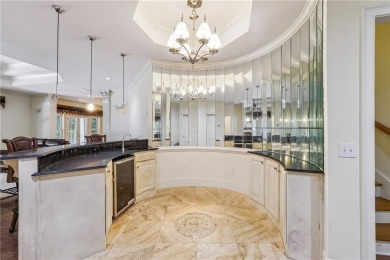 Experience three fully finished levels of exceptional living on The Golf Club of Georgia in Georgia - for sale on GolfHomes.com, golf home, golf lot