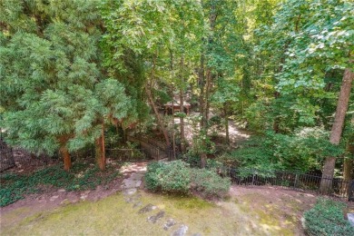 Experience three fully finished levels of exceptional living on The Golf Club of Georgia in Georgia - for sale on GolfHomes.com, golf home, golf lot