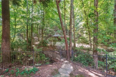 Experience three fully finished levels of exceptional living on The Golf Club of Georgia in Georgia - for sale on GolfHomes.com, golf home, golf lot