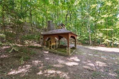 Experience three fully finished levels of exceptional living on The Golf Club of Georgia in Georgia - for sale on GolfHomes.com, golf home, golf lot