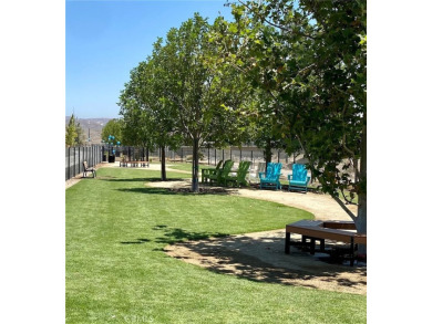 This modern turnkey home features three bedrooms, two and a half on Glen Ivy Golf Club in California - for sale on GolfHomes.com, golf home, golf lot