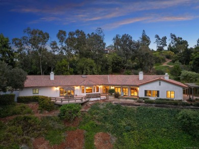 Nestled on a sprawling 2.9 acres, this stunning property boasts on Rancho Santa Fe Golf Club in California - for sale on GolfHomes.com, golf home, golf lot