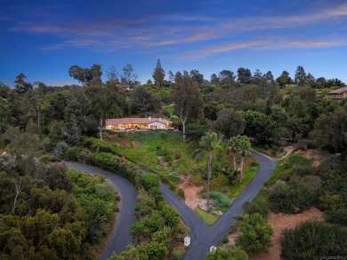 Nestled on a sprawling 2.9 acres, this stunning property boasts on Rancho Santa Fe Golf Club in California - for sale on GolfHomes.com, golf home, golf lot