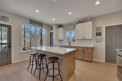 Nestled along the peaceful shores of Lake Arrowhead with on The Highlands Course at Lake Arrowhead in Georgia - for sale on GolfHomes.com, golf home, golf lot