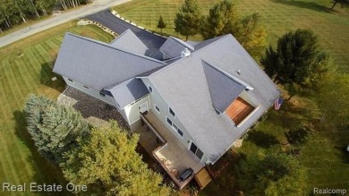 This unique Craftsman-style home offers 1 and a half stories and on Springport Hills Golf Course in Michigan - for sale on GolfHomes.com, golf home, golf lot