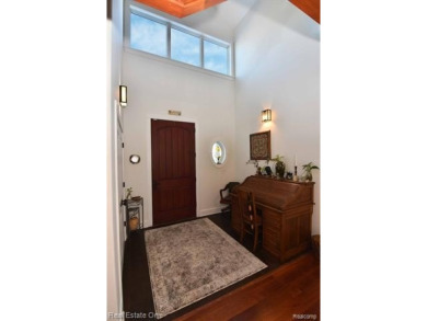 This unique Craftsman-style home offers 1 and a half stories and on Springport Hills Golf Course in Michigan - for sale on GolfHomes.com, golf home, golf lot